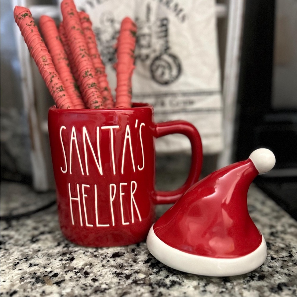6 chocolate dipped pretzels in a Christmas “SANTAS HELPER” Rae Dunn mug